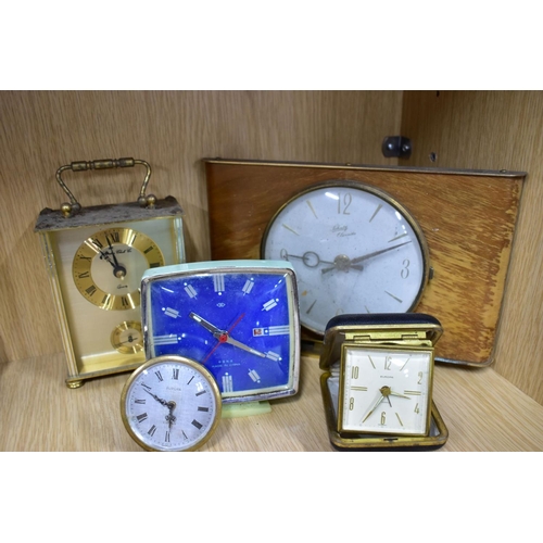 191 - NINETEEN MANTLE AND BEDSIDE CLOCKS, to include four plastic domed rotating pendulum clocks, such as ... 