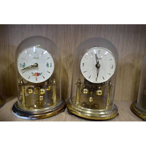 191 - NINETEEN MANTLE AND BEDSIDE CLOCKS, to include four plastic domed rotating pendulum clocks, such as ... 