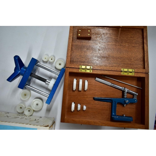 194 - A SELECTION OF WATCH AND CLOCK TOOLS, to include a boxed 'Anchor Glass Fitting Machine' with twenty ... 