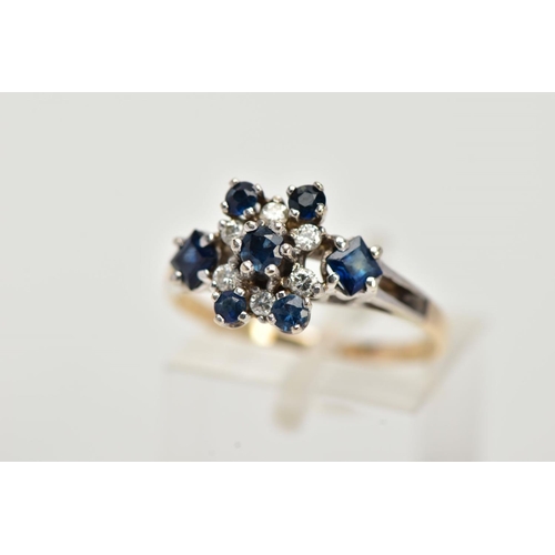 25 - A YELLOW METAL SAPPHIRE AND DIAMOND CLUSTER RING, set with a central claw set, circular cut blue sap... 