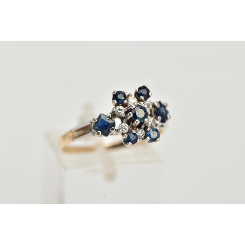 25 - A YELLOW METAL SAPPHIRE AND DIAMOND CLUSTER RING, set with a central claw set, circular cut blue sap... 