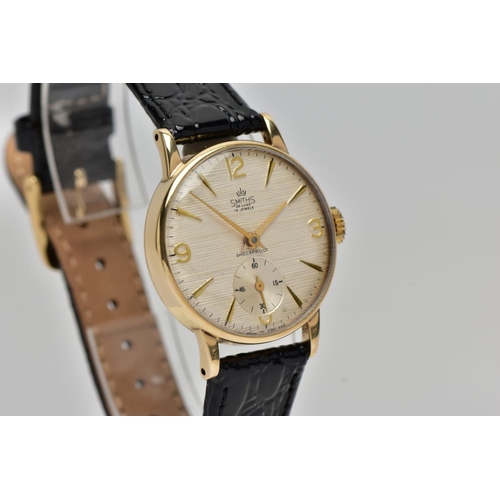 3 - A 9CT GOLD 'SMITHS', WRISTWATCH, hand wound movement, round gold textured dial signed 'Smith's De Lu... 