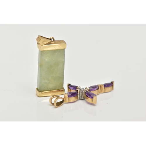 32 - TWO 9CT GOLD PENDANTS, to include a jade gold mounted pendant with a gold symbol, tapered shoulders ... 