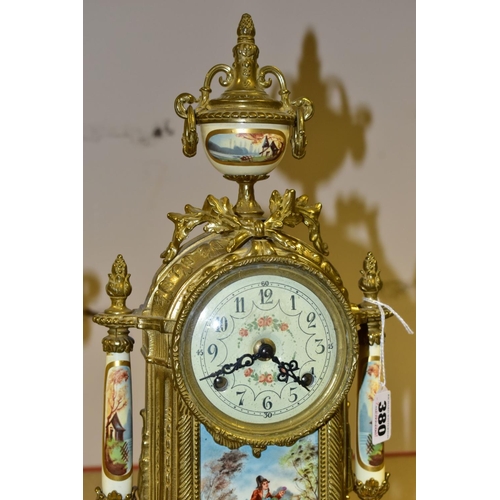 380 - A 20TH CENTURY BRASS AND PORCELAIN CLOCK GARNITURE, the porcelain panels transfer printed with coupl... 