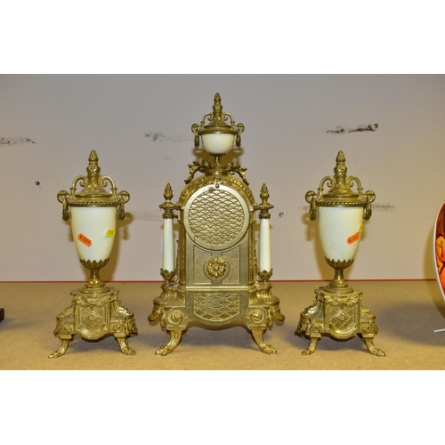 380 - A 20TH CENTURY BRASS AND PORCELAIN CLOCK GARNITURE, the porcelain panels transfer printed with coupl... 