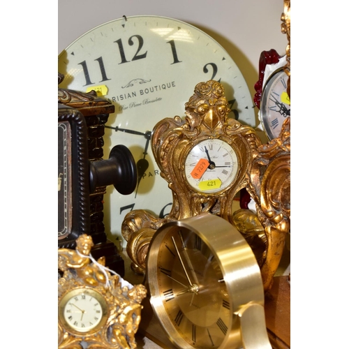 421 - ELEVEN VARIOUS CLOCKS, all with quartz movements, including two wall clocks, a Churchill mantel cloc... 