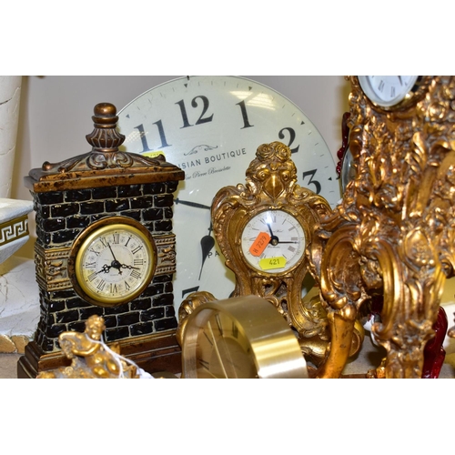 421 - ELEVEN VARIOUS CLOCKS, all with quartz movements, including two wall clocks, a Churchill mantel cloc... 