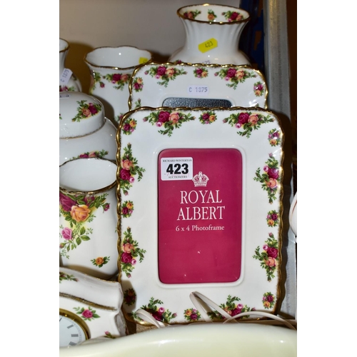 423 - A COLLECTION OF ROYAL ALBERT OLD COUNTRY ROSES, includes an Astral telephone, two quartz movement ma... 