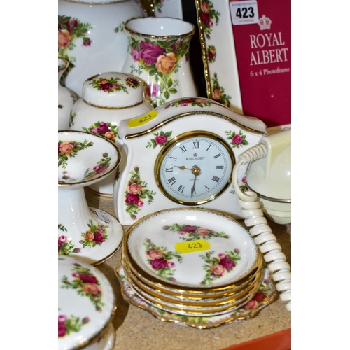 423 - A COLLECTION OF ROYAL ALBERT OLD COUNTRY ROSES, includes an Astral telephone, two quartz movement ma... 