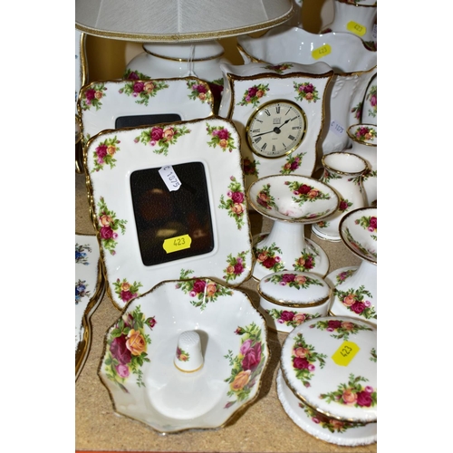 423 - A COLLECTION OF ROYAL ALBERT OLD COUNTRY ROSES, includes an Astral telephone, two quartz movement ma... 