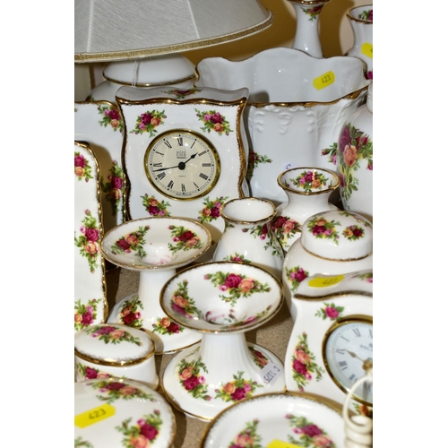 423 - A COLLECTION OF ROYAL ALBERT OLD COUNTRY ROSES, includes an Astral telephone, two quartz movement ma... 