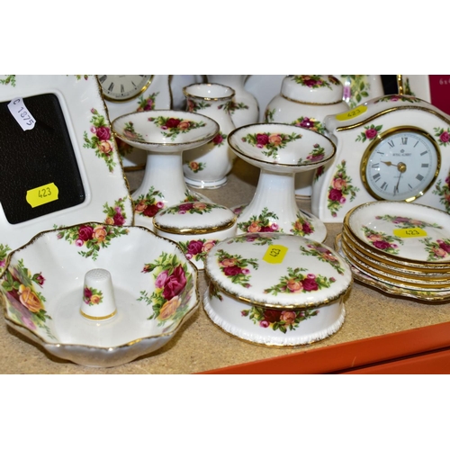 423 - A COLLECTION OF ROYAL ALBERT OLD COUNTRY ROSES, includes an Astral telephone, two quartz movement ma... 