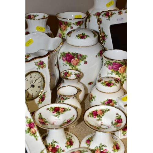 423 - A COLLECTION OF ROYAL ALBERT OLD COUNTRY ROSES, includes an Astral telephone, two quartz movement ma... 