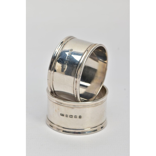 45 - TWO SILVER NAPKIN RINGS, plain polished design reeded rims, one engraved with an initial 'M' the oth... 