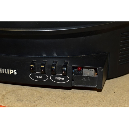 450 - A PHILIPS DISCOVERER TV SHAPED AS SPACE HELMET, in red and black with sliding visor over the screen,... 