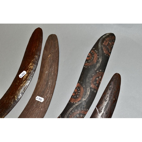 451 - FOUR TRIBAL ART AUSTRALIAN ABORIGINAL BOOMERANGS, to include one carved to the side of arrows, cross... 