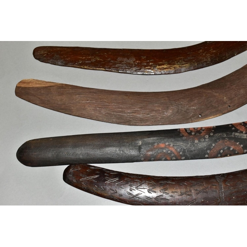 451 - FOUR TRIBAL ART AUSTRALIAN ABORIGINAL BOOMERANGS, to include one carved to the side of arrows, cross... 