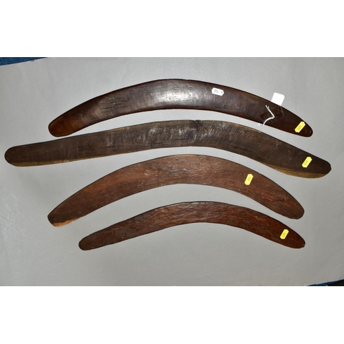 451 - FOUR TRIBAL ART AUSTRALIAN ABORIGINAL BOOMERANGS, to include one carved to the side of arrows, cross... 