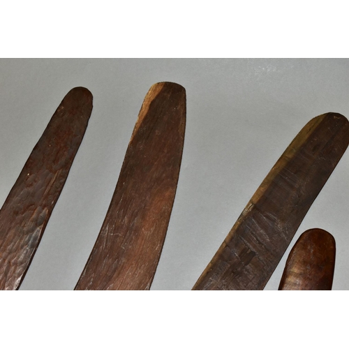 451 - FOUR TRIBAL ART AUSTRALIAN ABORIGINAL BOOMERANGS, to include one carved to the side of arrows, cross... 