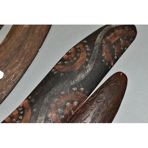 451 - FOUR TRIBAL ART AUSTRALIAN ABORIGINAL BOOMERANGS, to include one carved to the side of arrows, cross... 