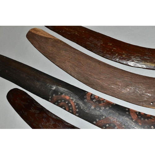 451 - FOUR TRIBAL ART AUSTRALIAN ABORIGINAL BOOMERANGS, to include one carved to the side of arrows, cross... 