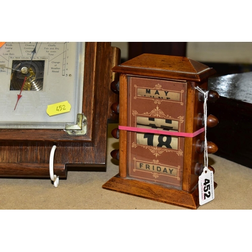 452 - AN OAK CASED PERPETUAL CALENDAR, height 16cm (numbers not working), together with a small oak barome... 