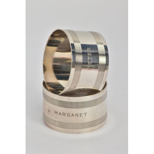 46 - TWO SILVER NAPKIN RINGS, each of an engine turn design, one engraved 'Margaret', the other engraved ... 