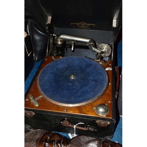 470 - A COLUMBIA PORTABLE GRAMOPHONE, NO.202, together with a pair of carved wooden wall/face plaques, hei... 