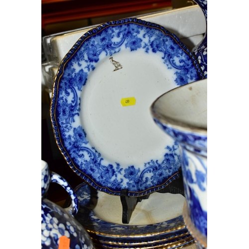 499 - ROYAL DOLTON FLOW BLUE 'MELROSE' PATTERN DINNER WARES, comprising six soup bowls (four damaged), six... 