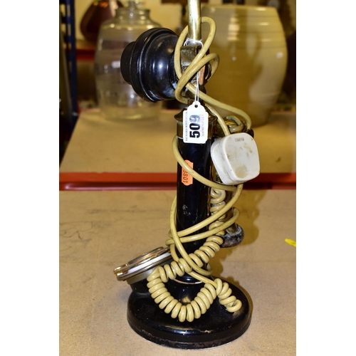 509 - A VINTAGE CANDLESTICK TELEPHONE, converted into a table lamp, height excluding shade 46cm, not teste... 