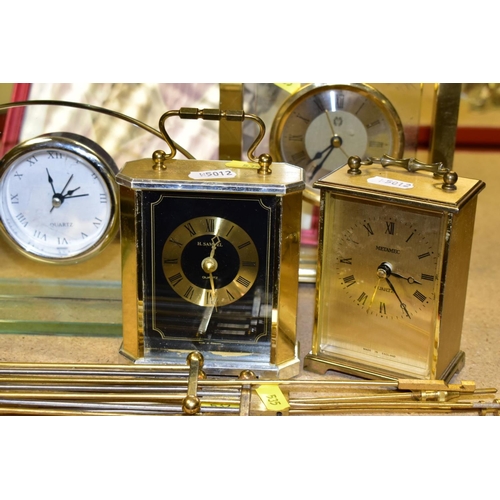 535 - A GROUP OF SIX QUARTZ MANTLE CLOCKS, four modern clock pendulums, a framed and glazed 'STAIRWAY OF L... 