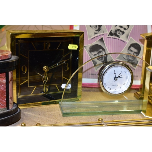 535 - A GROUP OF SIX QUARTZ MANTLE CLOCKS, four modern clock pendulums, a framed and glazed 'STAIRWAY OF L... 