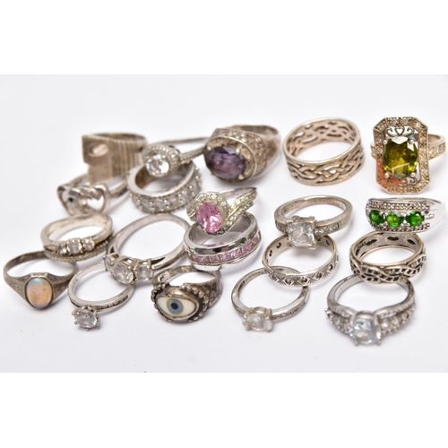 58 - A BAG OF ASSORTED RINGS, twenty white metal rings to include a silver ring designed with a central o... 