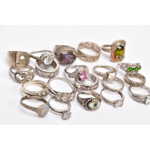 58 - A BAG OF ASSORTED RINGS, twenty white metal rings to include a silver ring designed with a central o... 