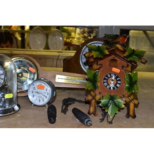 632 - A SMALL GROUP OF SEVEN CLOCKS AND A MODERN BAROMETER, the clocks include an Edwardian mahogany, oak ... 