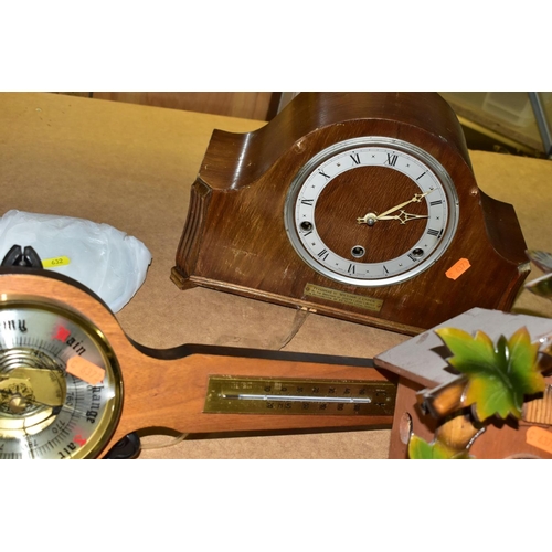 632 - A SMALL GROUP OF SEVEN CLOCKS AND A MODERN BAROMETER, the clocks include an Edwardian mahogany, oak ... 