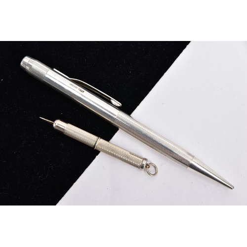 65 - A SILVER PROPELLING PENCIL AND A SILVER CIGAR PIERCER, the propelling pencil with an engine turn des... 