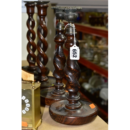 652 - FIVE CLOCKS AND TWO PAIRS OF OAK BARLEY TWIST CANDLESTICKS, candlestick heights 29cm and 31cm approx... 