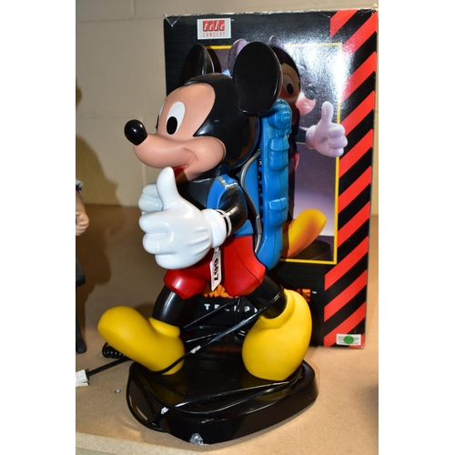 667 - A BOXED TELE CONCEPT MICKEY MOUSE TELEPHONE, modelled as a walking figure with the handset modelled ... 