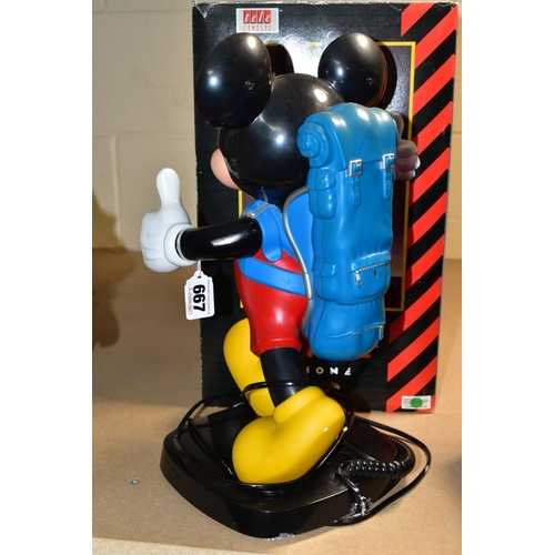 667 - A BOXED TELE CONCEPT MICKEY MOUSE TELEPHONE, modelled as a walking figure with the handset modelled ... 