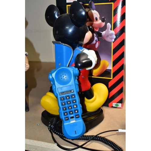 667 - A BOXED TELE CONCEPT MICKEY MOUSE TELEPHONE, modelled as a walking figure with the handset modelled ... 