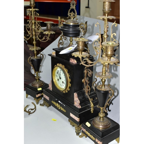 692 - A LATE 19TH CENTURY BLACK SLATE, MARBLE AND GILT METAL CLOCK GARNITURE, the clock with urn shaped su... 