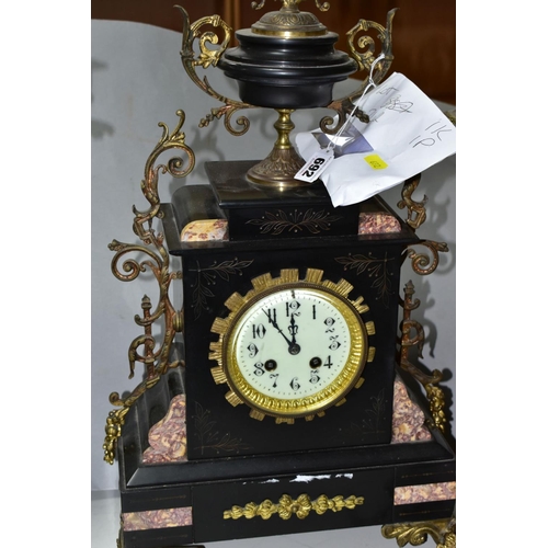 692 - A LATE 19TH CENTURY BLACK SLATE, MARBLE AND GILT METAL CLOCK GARNITURE, the clock with urn shaped su... 