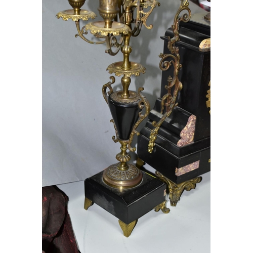 692 - A LATE 19TH CENTURY BLACK SLATE, MARBLE AND GILT METAL CLOCK GARNITURE, the clock with urn shaped su... 