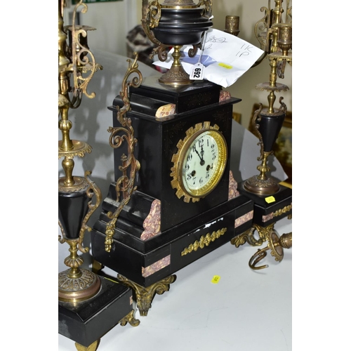 692 - A LATE 19TH CENTURY BLACK SLATE, MARBLE AND GILT METAL CLOCK GARNITURE, the clock with urn shaped su... 