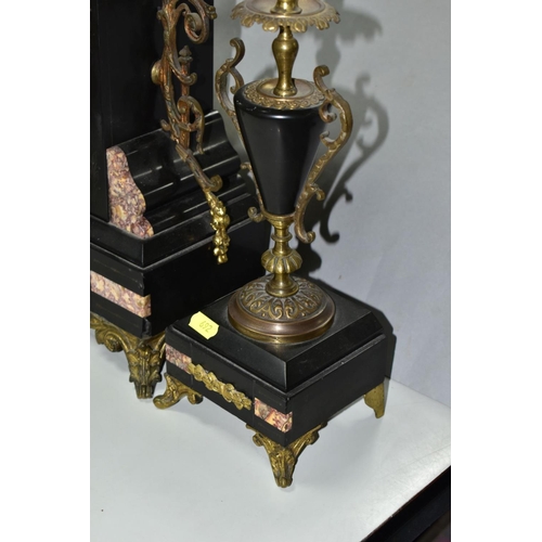 692 - A LATE 19TH CENTURY BLACK SLATE, MARBLE AND GILT METAL CLOCK GARNITURE, the clock with urn shaped su... 