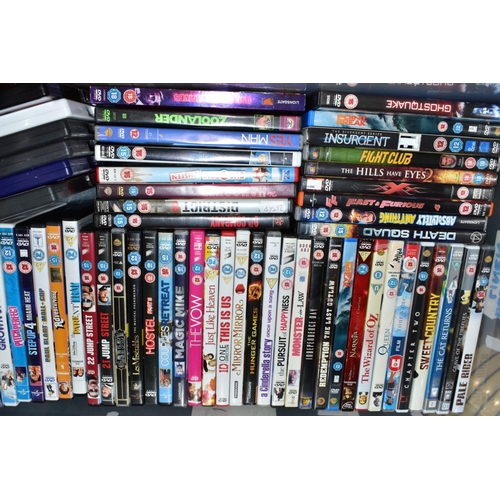 697 - NINE BOXES OF DVD'S, ETC, to include films - Hellboy, Safe House, Hitch, Kings Speech, Black Hawk Do... 