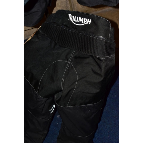 740 - A PAIR OF TRIUMPH AIRFLOW TECH MOTORBIKE TROUSERS, a pair of AKITO motorbike trousers, a Simply Deve... 