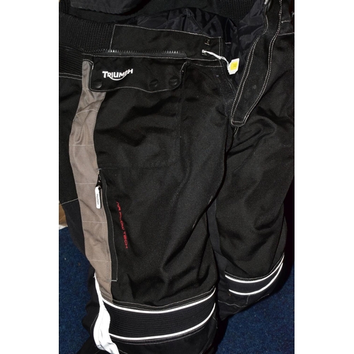 740 - A PAIR OF TRIUMPH AIRFLOW TECH MOTORBIKE TROUSERS, a pair of AKITO motorbike trousers, a Simply Deve... 