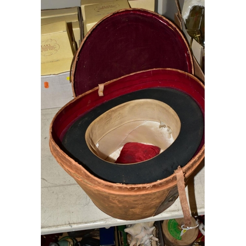 746 - A LEATHER TOP HAT BOX (dent to side), containing a Tress & Co London top hat, 8 x 6¼ - signs of wear... 